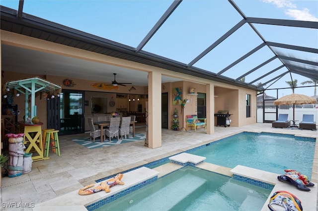 view of swimming pool with a patio, a grill, a pool with connected hot tub, outdoor dining area, and ceiling fan