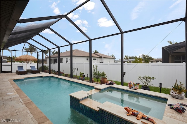 view of pool with a fenced backyard, a patio, glass enclosure, and a pool with connected hot tub