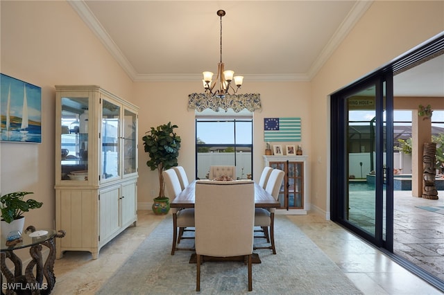 dining area featuring a chandelier, ornamental molding, and baseboards