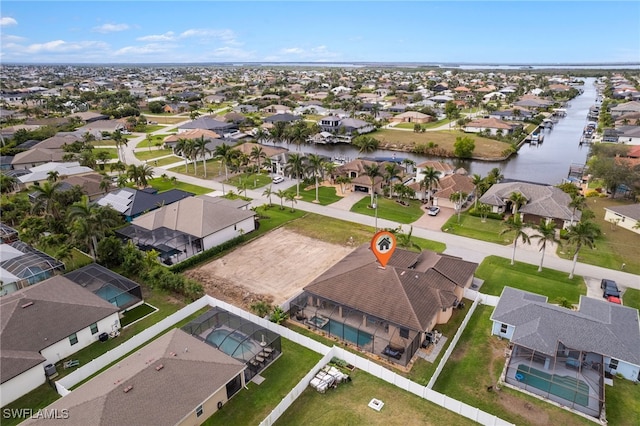 aerial view featuring a water view and a residential view