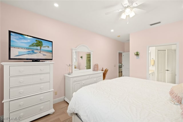 5794 Elizabeth Ann Way, Fort Myers, FL 33912 - bedroom with light wood-type flooring, ensuite bath, visible vents, recessed lighting, and baseboards