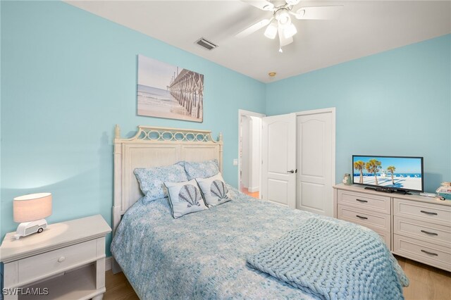 5794 Elizabeth Ann Way, Fort Myers, FL 33912 - bedroom with visible vents, a ceiling fan, and wood finished floors