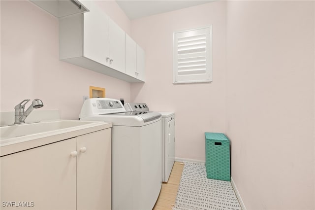 5794 Elizabeth Ann Way, Fort Myers, FL 33912 - laundry room featuring washer and dryer, baseboards, a sink, and cabinet space
