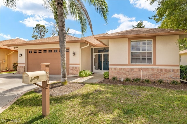5794 Elizabeth Ann Way, Fort Myers, FL 33912 - ranch-style home with brick siding, driveway, a garage, and stucco siding