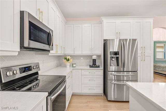 5794 Elizabeth Ann Way, Fort Myers, FL 33912 - kitchen with tasteful backsplash, light wood finished floors, white cabinetry, light stone countertops, and stainless steel appliances