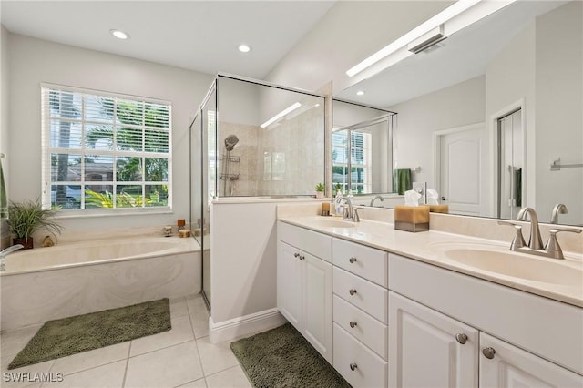 full bathroom with a shower stall, tile patterned flooring, plenty of natural light, and a sink