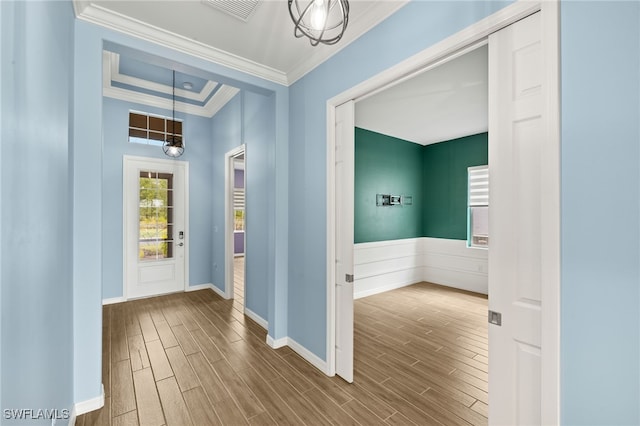 foyer with plenty of natural light, visible vents, and dark wood-style floors