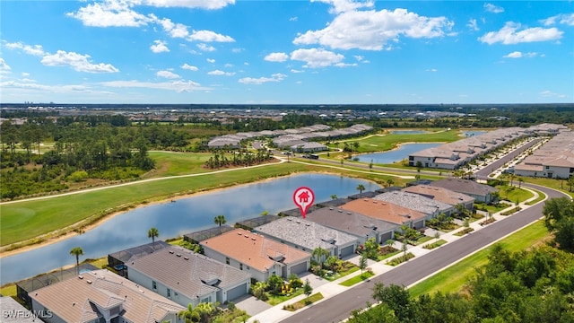 aerial view with golf course view, a residential view, and a water view