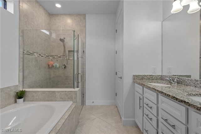 full bath with a sink, a bath, double vanity, and a stall shower