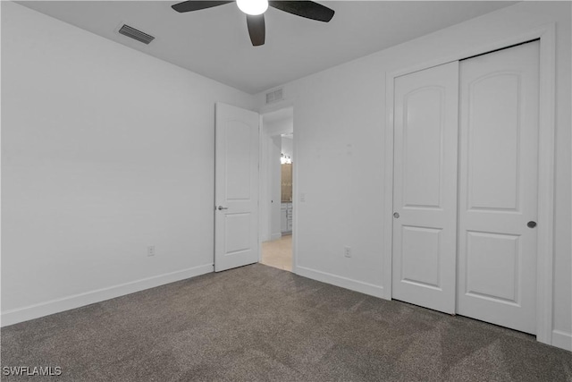 unfurnished bedroom with visible vents, baseboards, a closet, and carpet floors