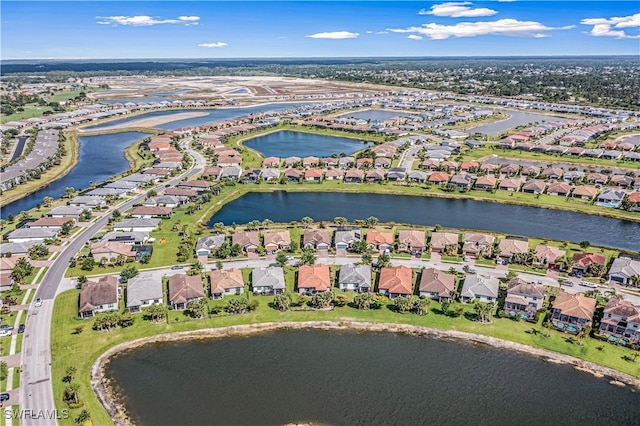 aerial view featuring a residential view and a water view