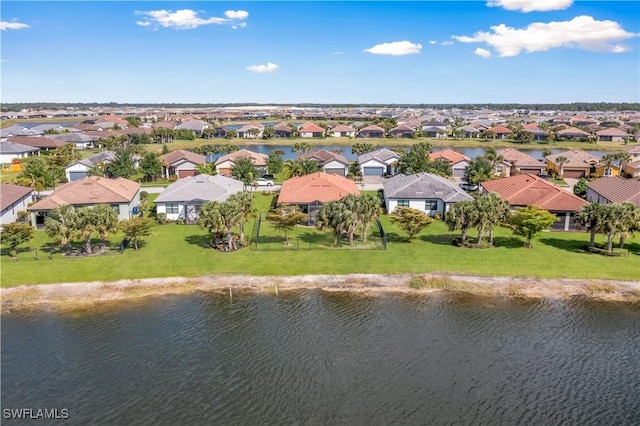 bird's eye view featuring a water view and a residential view