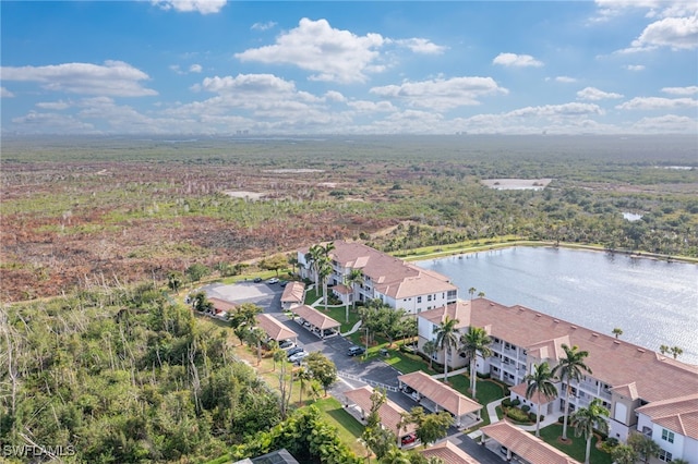 birds eye view of property with a water view and a residential view