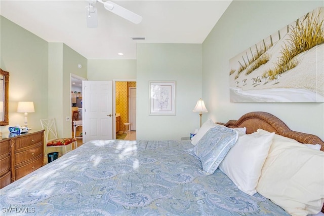 bedroom with ceiling fan, ensuite bathroom, and visible vents
