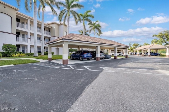 view of partially covered parking lot