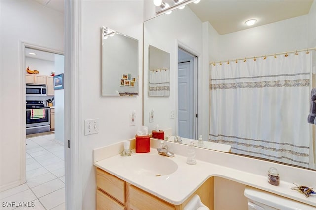 bathroom with vanity and tile patterned flooring