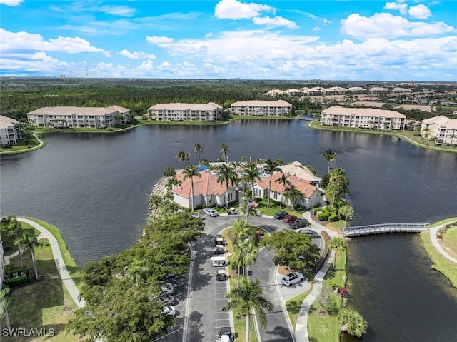 bird's eye view featuring a residential view and a water view