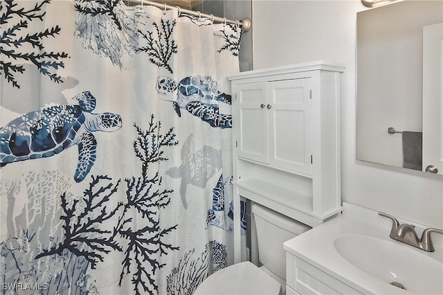 8150 Cleaves Rd, North Fort Myers, FL 33903 - full bath with toilet, vanity, and a shower with shower curtain