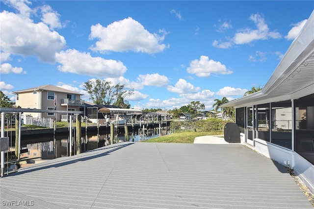 8150 Cleaves Rd, North Fort Myers, FL 33903 - deck featuring a sunroom, a dock, and a water view