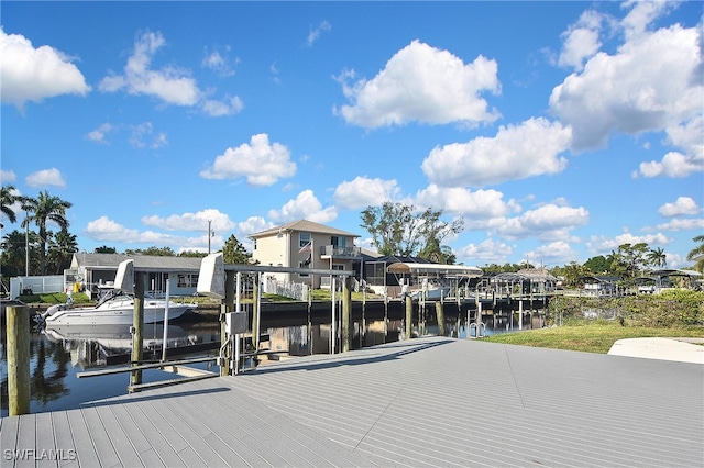 8150 Cleaves Rd, North Fort Myers, FL 33903 - view of dock with a water view, a residential view, and boat lift