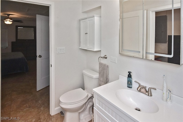 8150 Cleaves Rd, North Fort Myers, FL 33903 - bathroom featuring vanity, a ceiling fan, and toilet