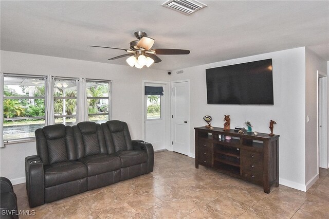8150 Cleaves Rd, North Fort Myers, FL 33903 - living area with baseboards, a ceiling fan, and visible vents