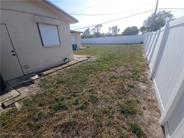 view of yard with a fenced backyard