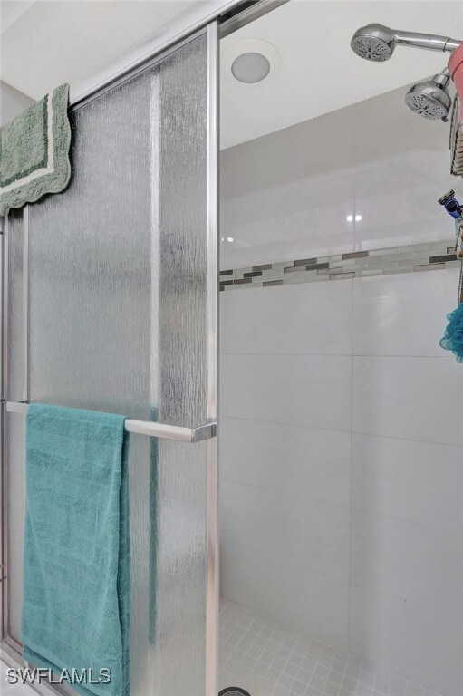 bathroom featuring a stall shower