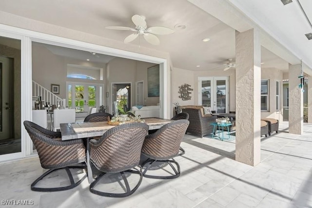 61 N Barfield Dr, Marco Island, FL 34145 - view of patio / terrace with french doors, outdoor dining space, and ceiling fan