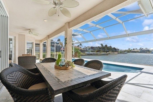 61 N Barfield Dr, Marco Island, FL 34145 - view of patio / terrace featuring ceiling fan, a water view, outdoor dining area, and a lanai