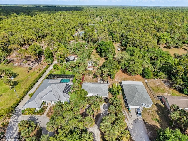 birds eye view of property with a wooded view