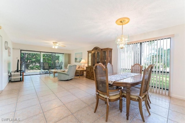 232 Pebble Beach Cir Unit E104, Naples, FL 34113 - dining space featuring a chandelier, a ceiling fan, and light tile patterned floors