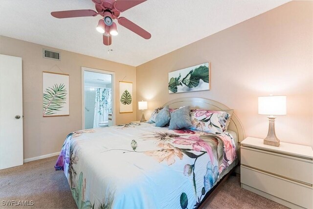 232 Pebble Beach Cir Unit E104, Naples, FL 34113 - bedroom with carpet, ensuite bath, a ceiling fan, and baseboards