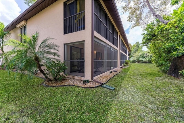 232 Pebble Beach Cir Unit E104, Naples, FL 34113 - view of side of property with stucco siding and a lawn