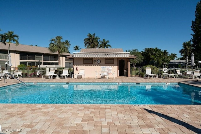 232 Pebble Beach Cir Unit E104, Naples, FL 34113 - community pool with a patio
