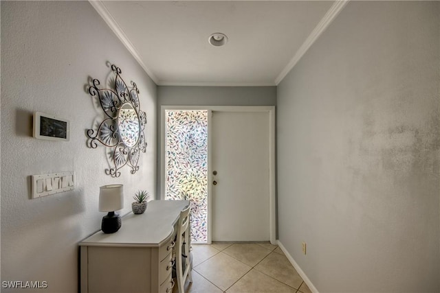 entryway featuring light tile patterned floors, baseboards, and ornamental molding