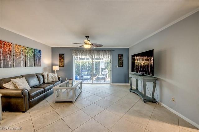 living area featuring crown molding, light tile patterned floors, ceiling fan, and baseboards