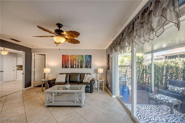 living area with light tile patterned floors, baseboards, visible vents, ornamental molding, and a ceiling fan