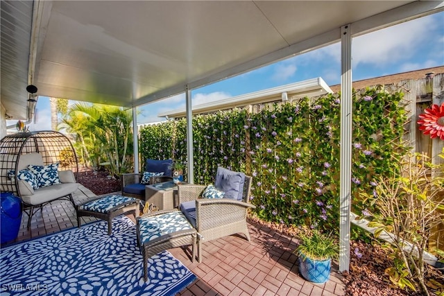 view of patio / terrace featuring a fenced backyard and an outdoor living space