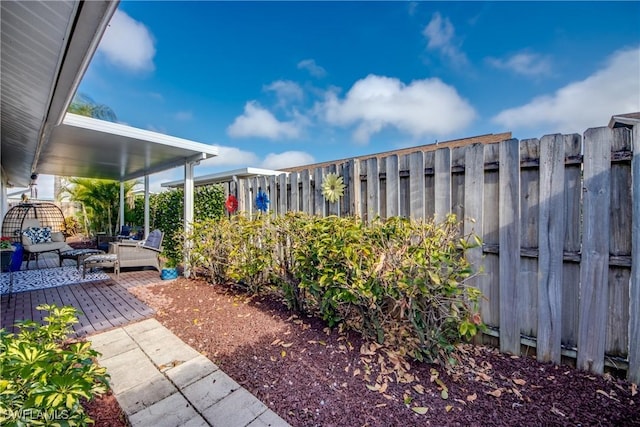view of yard with a patio area, an outdoor living space, and fence