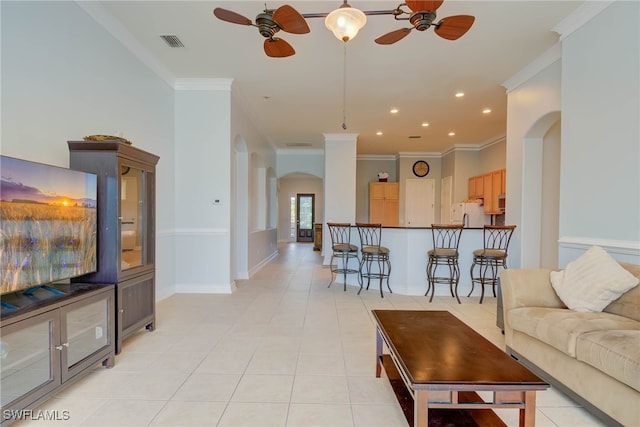 2042 Mandarin Ln, Naples, FL 34120 - living room with arched walkways, a ceiling fan, crown molding, light tile patterned floors, and recessed lighting