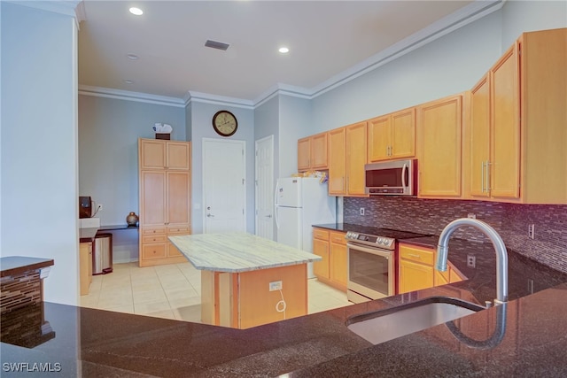 2042 Mandarin Ln, Naples, FL 34120 - kitchen featuring appliances with stainless steel finishes, crown molding, a sink, dark stone countertops, and light brown cabinets