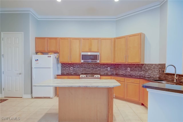2042 Mandarin Ln, Naples, FL 34120 - kitchen with stainless steel appliances, a sink, light brown cabinets, crown molding, and light tile patterned floors