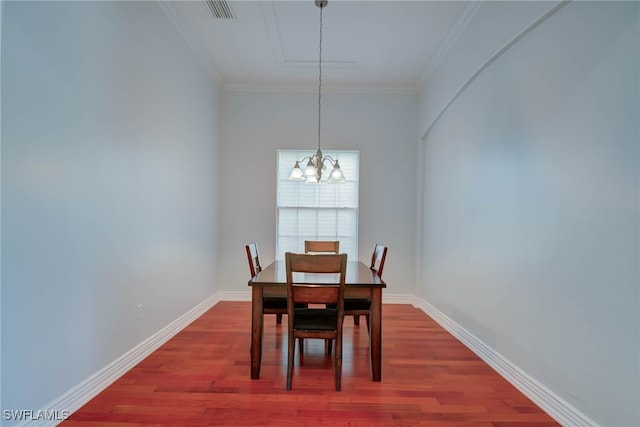 2042 Mandarin Ln, Naples, FL 34120 - dining space featuring dark wood-style floors, a chandelier, crown molding, and baseboards