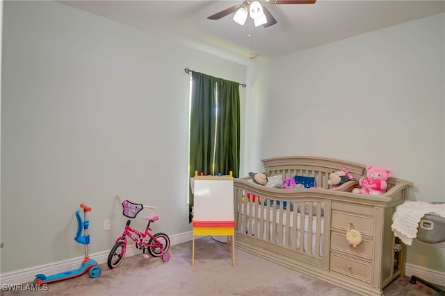 2042 Mandarin Ln, Naples, FL 34120 - bedroom with carpet, baseboards, ceiling fan, and a crib