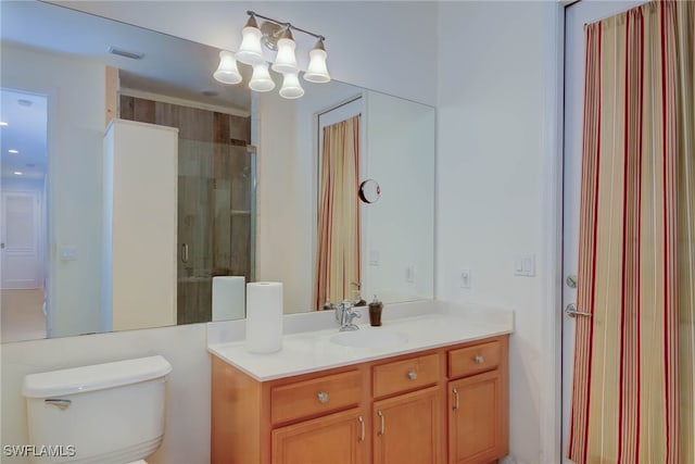 2042 Mandarin Ln, Naples, FL 34120 - full bathroom with toilet, a chandelier, vanity, and a shower