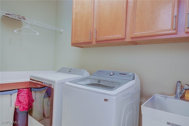 2042 Mandarin Ln, Naples, FL 34120 - washroom with washer and dryer and cabinet space