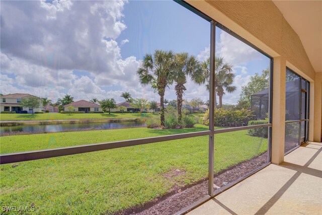 2042 Mandarin Ln, Naples, FL 34120 - unfurnished sunroom with a water view