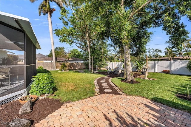 view of yard with a patio area and a fenced backyard