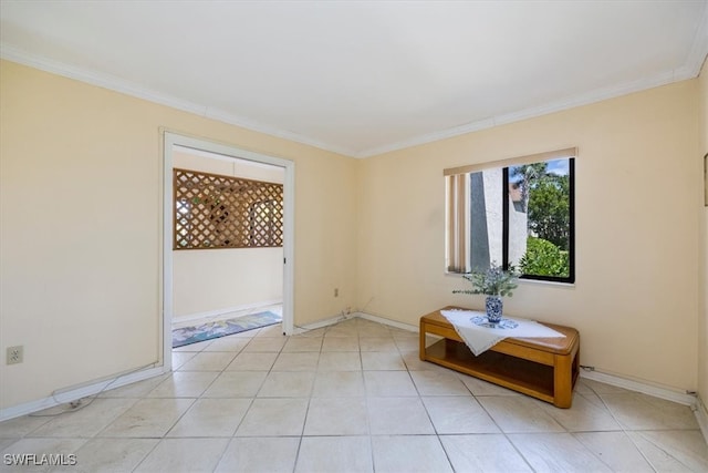 empty room with baseboards and ornamental molding